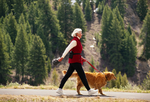woman walking a dog woman walking a dog